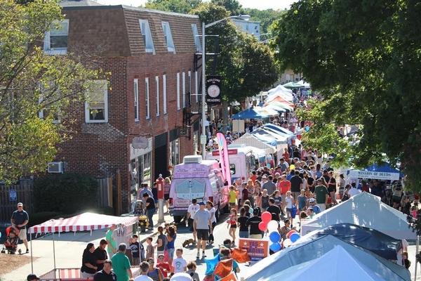 Aerial view of Haven Street in Reading MA with crowds and tents for the Reading Street Faire